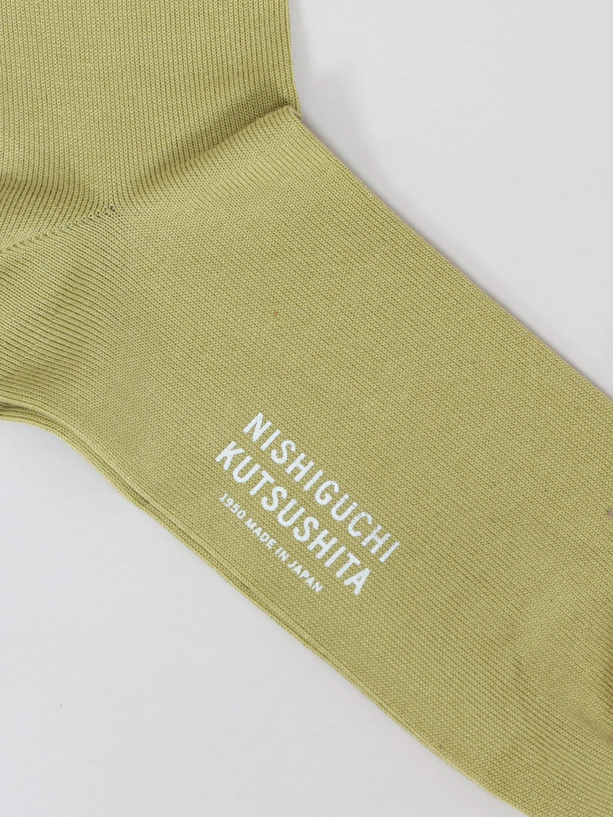 Nishiguchi Kutsushita, Egyptian Cotton Plain Socks. Pistachio Sofa